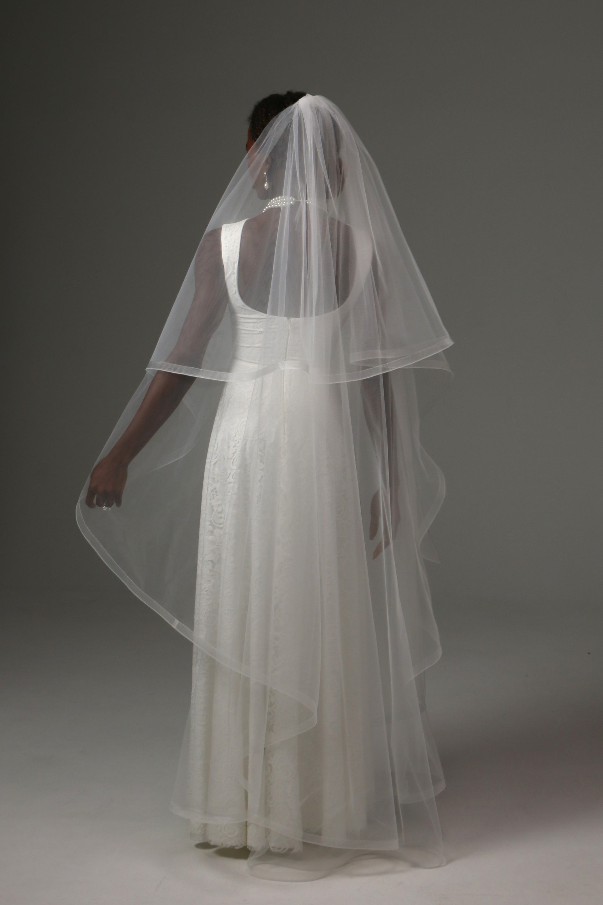 Two-tier waltz bridal veil combining timeless elegance and modern sophistication.