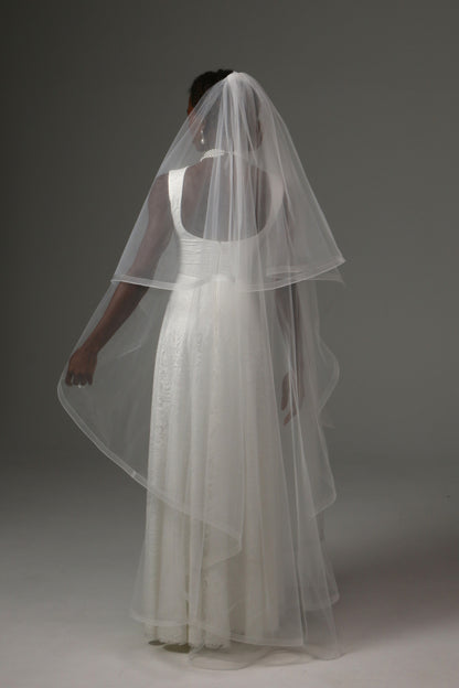 Two-tier waltz bridal veil combining timeless elegance and modern sophistication.