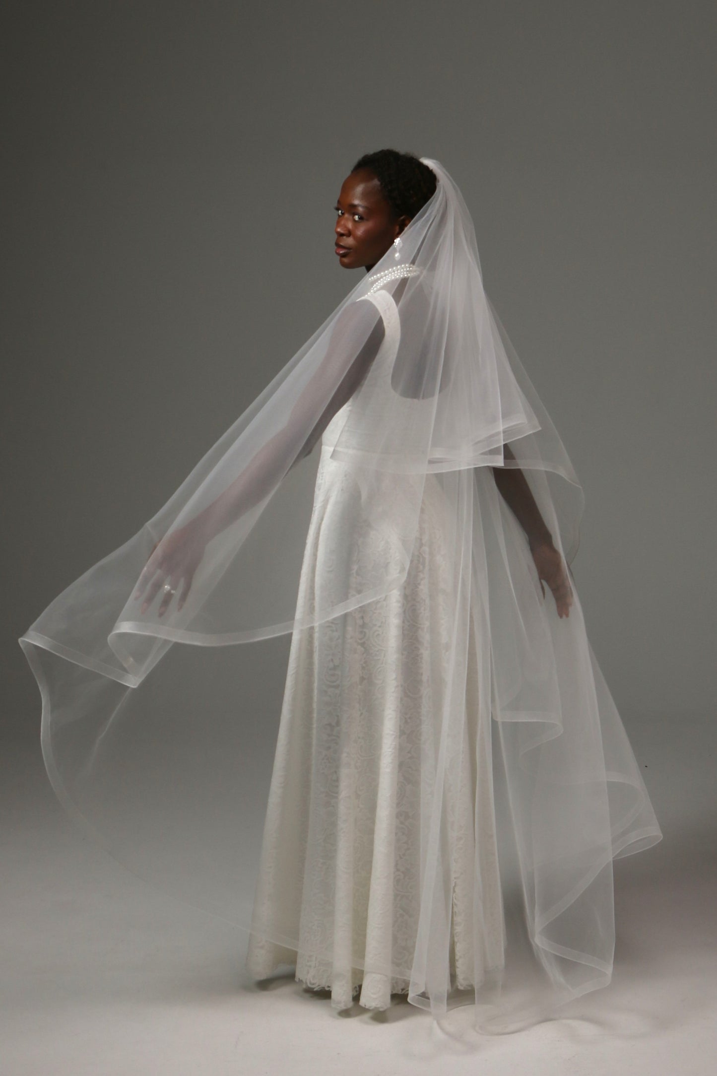 Waltz-length wedding veil with horsehair edge and blusher.