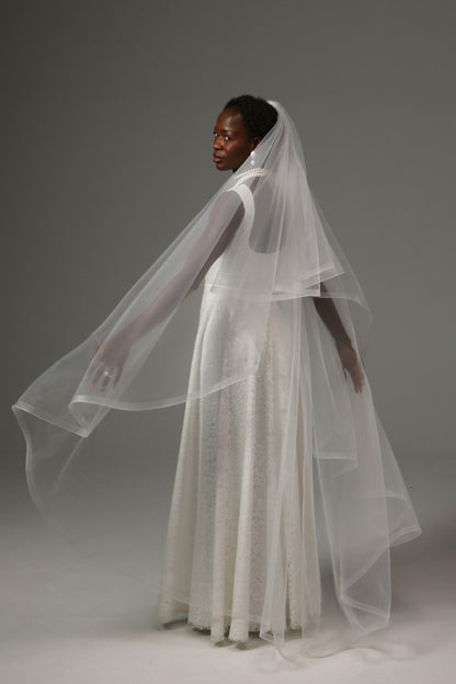 Waltz-length wedding veil with horsehair edge and blusher.