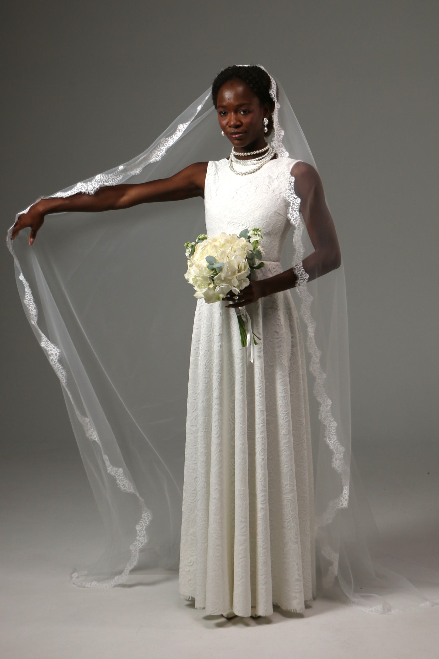Soft illusion tulle mantilla veil with timeless lace detail.