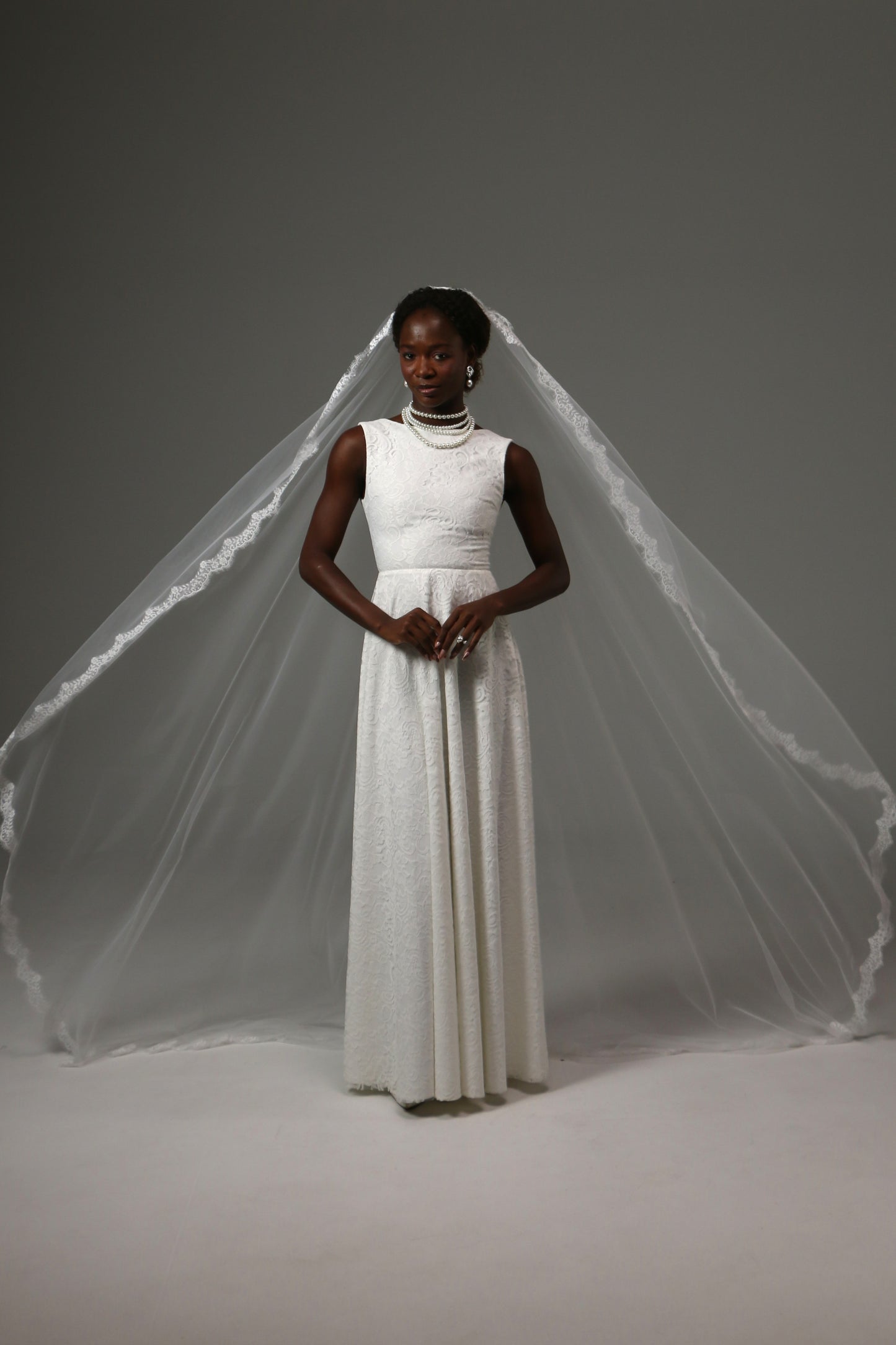 Lightweight mantilla wedding veil with elegant face-framing design.