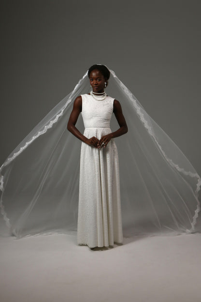 Lightweight mantilla wedding veil with elegant face-framing design.