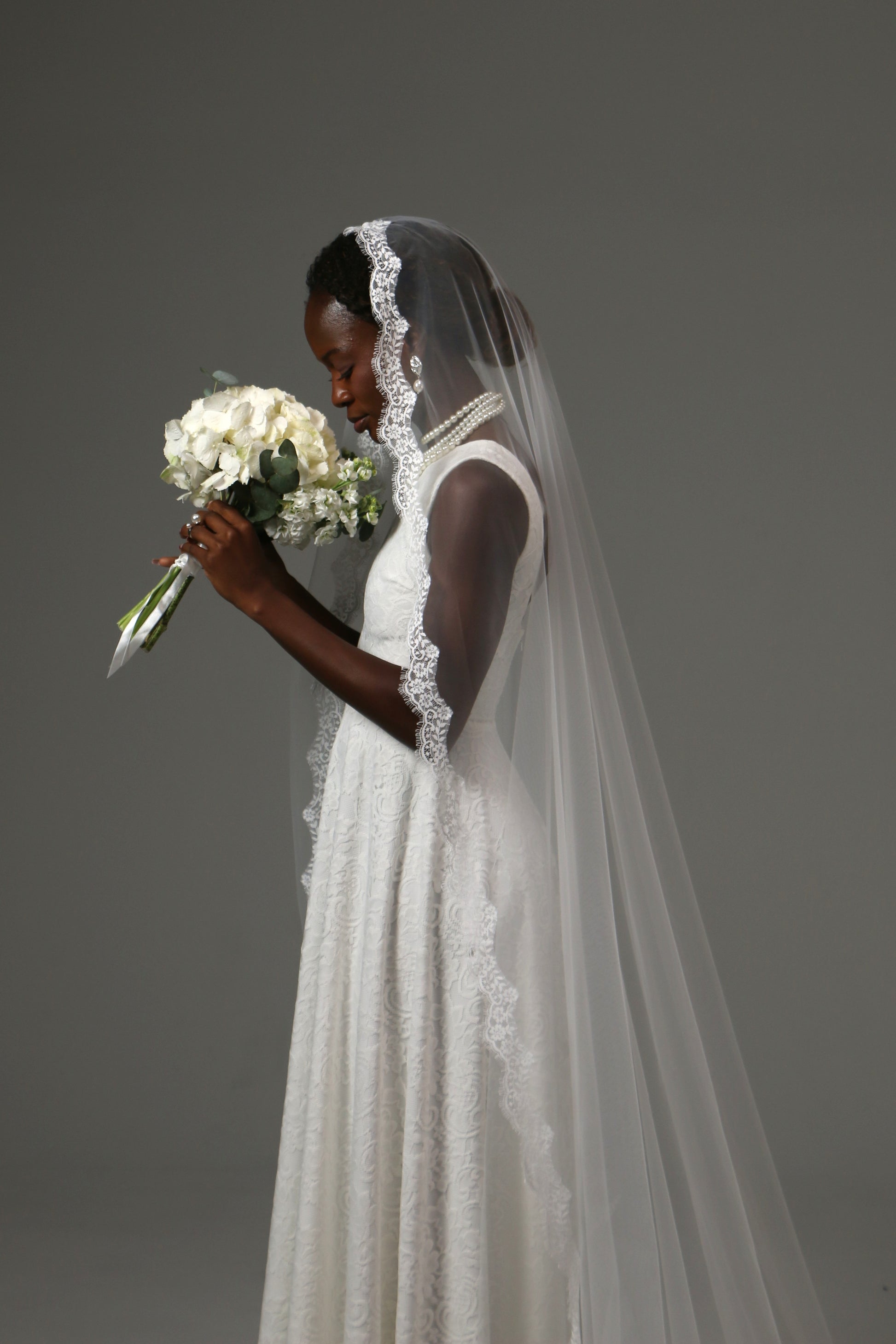 Handmade cathedral veil with floral lace border.