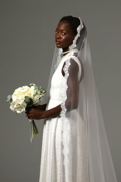 Soft tulle cathedral veil paired with a lace wedding dress.