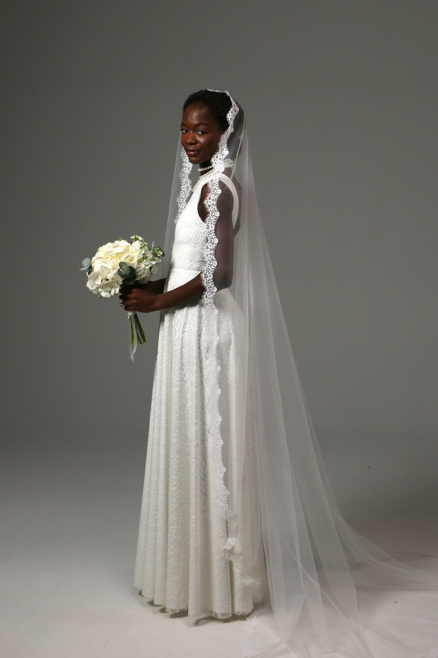 Elegant mantilla veil designed for church wedding ceremonies.