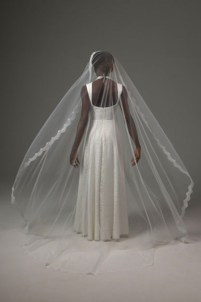 One-tier mantilla bridal veil with graceful flowing silhouette.