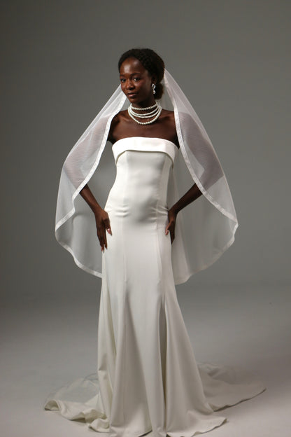 One-tier wedding veil styled with a minimalist satin gown.