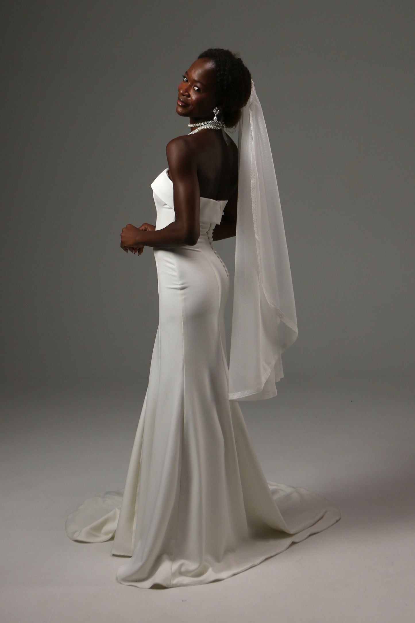 Lightweight wedding veil crafted from dotted illusion tulle.