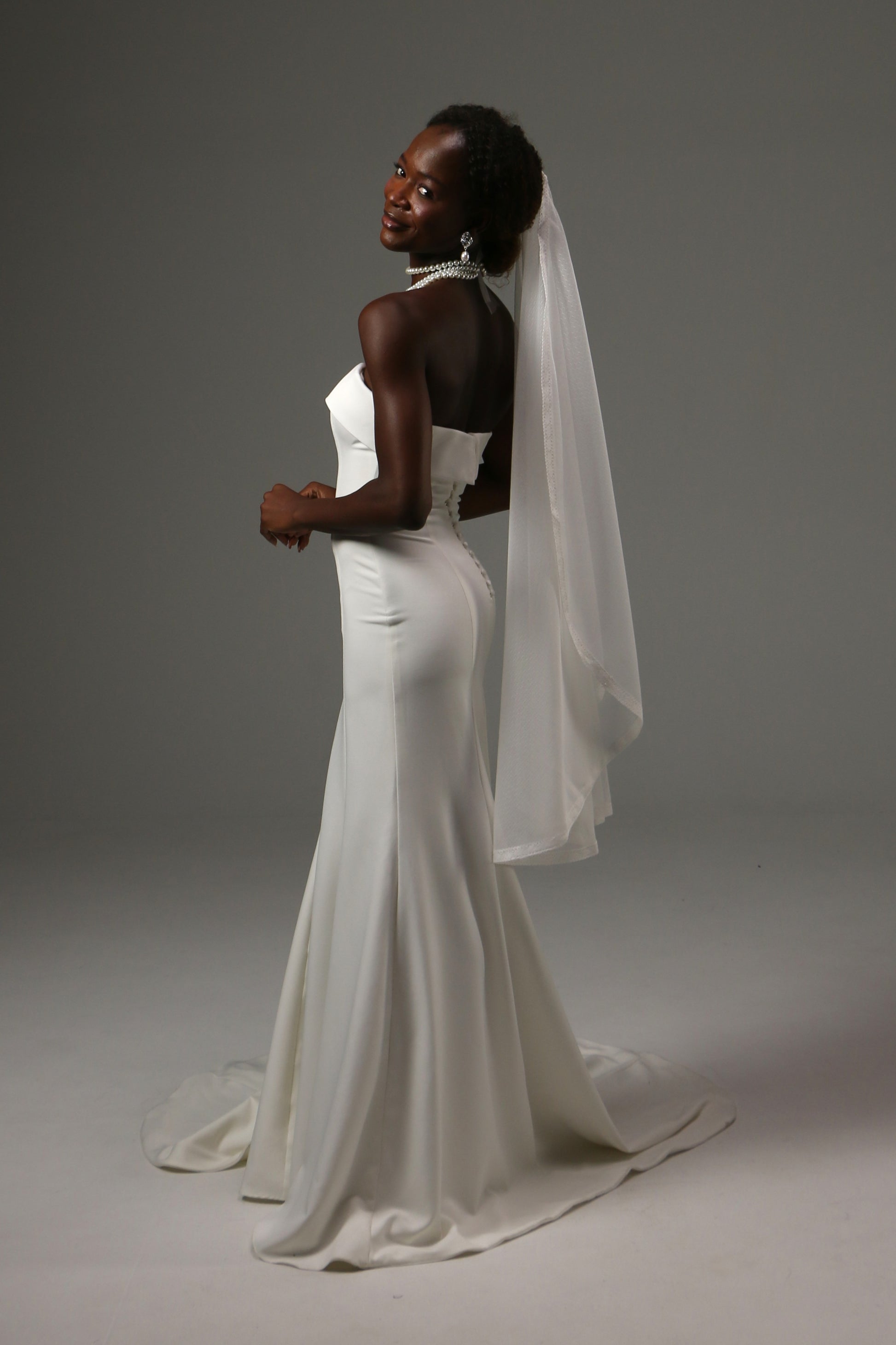 Lightweight wedding veil crafted from dotted illusion tulle.