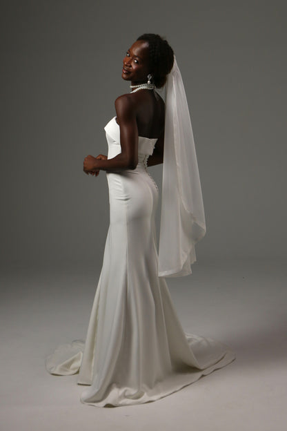 Lightweight wedding veil crafted from dotted illusion tulle.