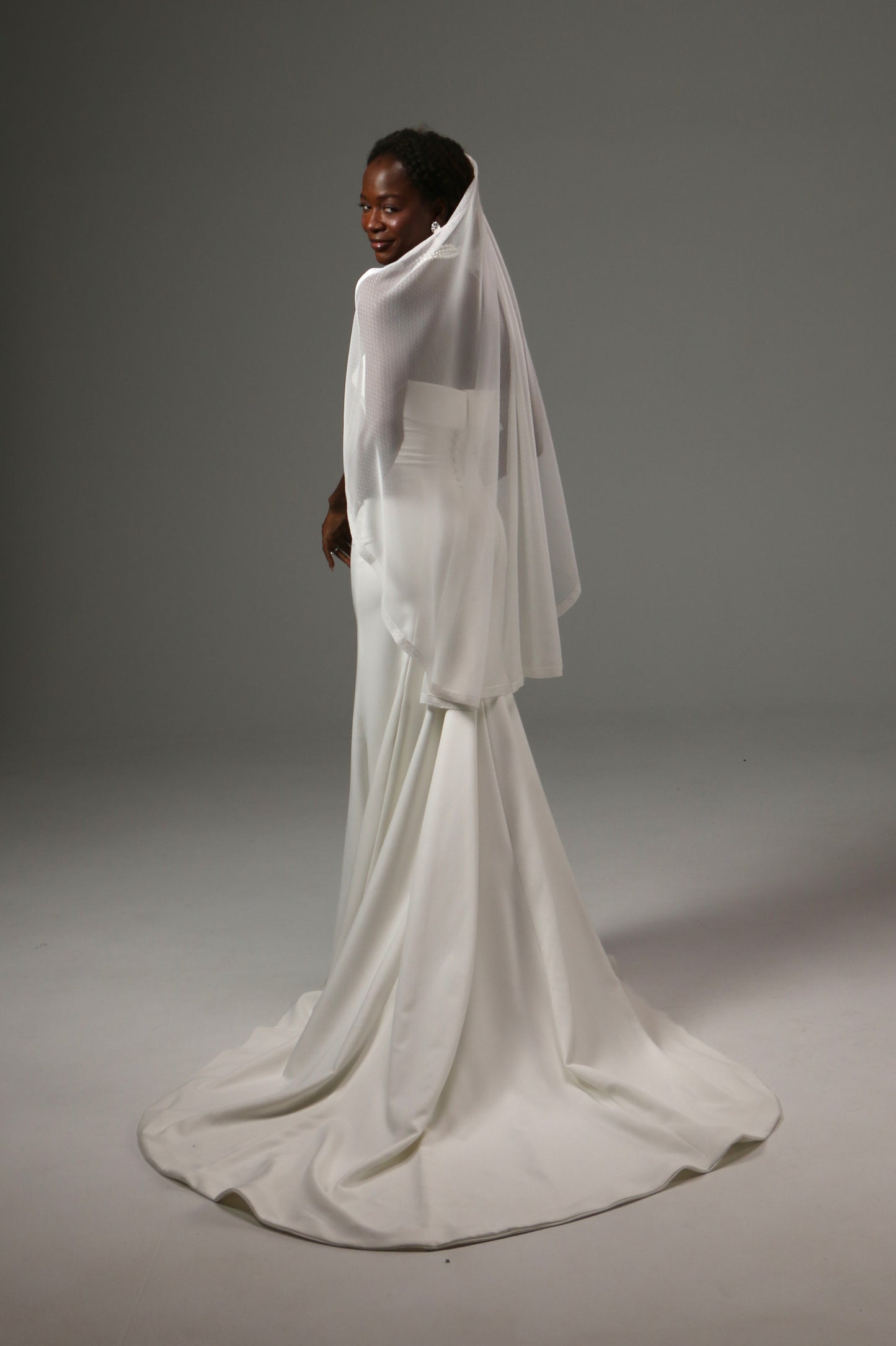 Modern wedding veil with elegant flowing movement.