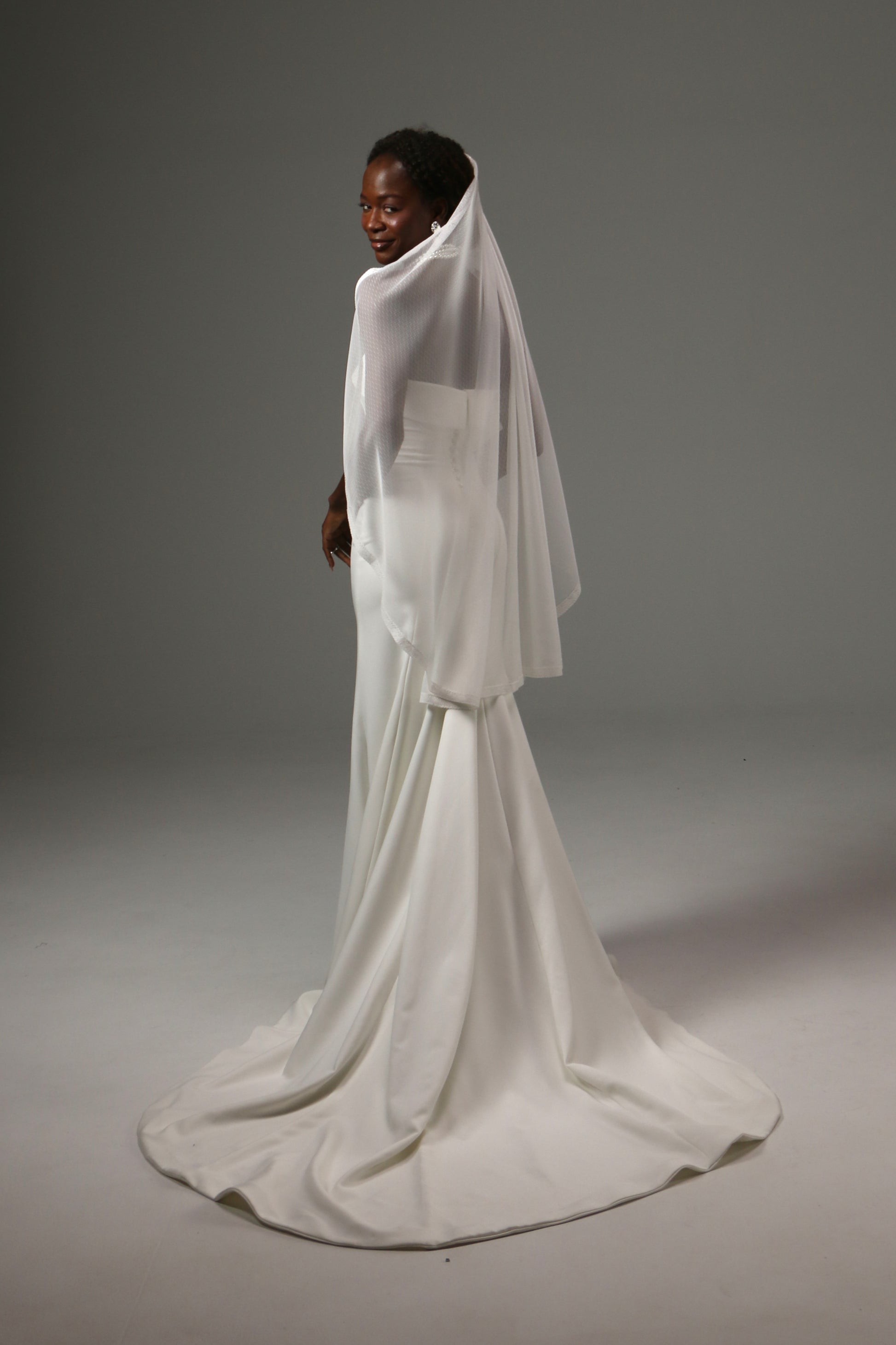 Modern wedding veil with elegant flowing movement.