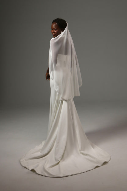 Modern wedding veil with elegant flowing movement.