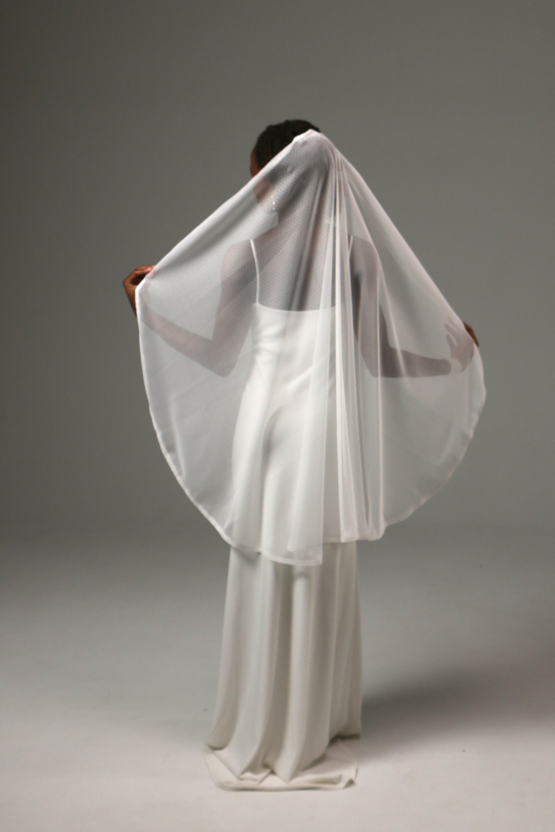 Modern bridal veil with vintage-inspired dotted tulle design.