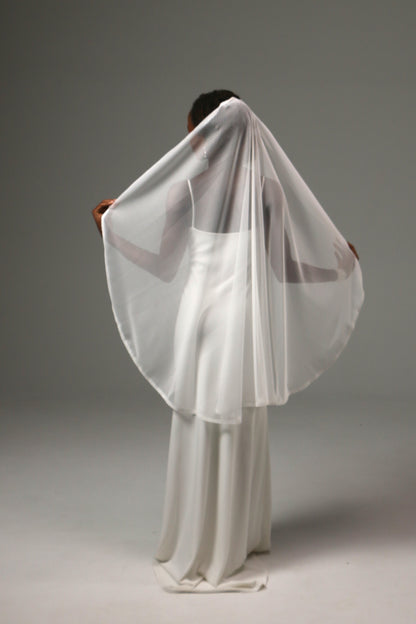 Modern bridal veil with vintage-inspired dotted tulle design.