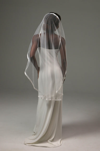 Fingertip wedding veil offering graceful movement and comfort.