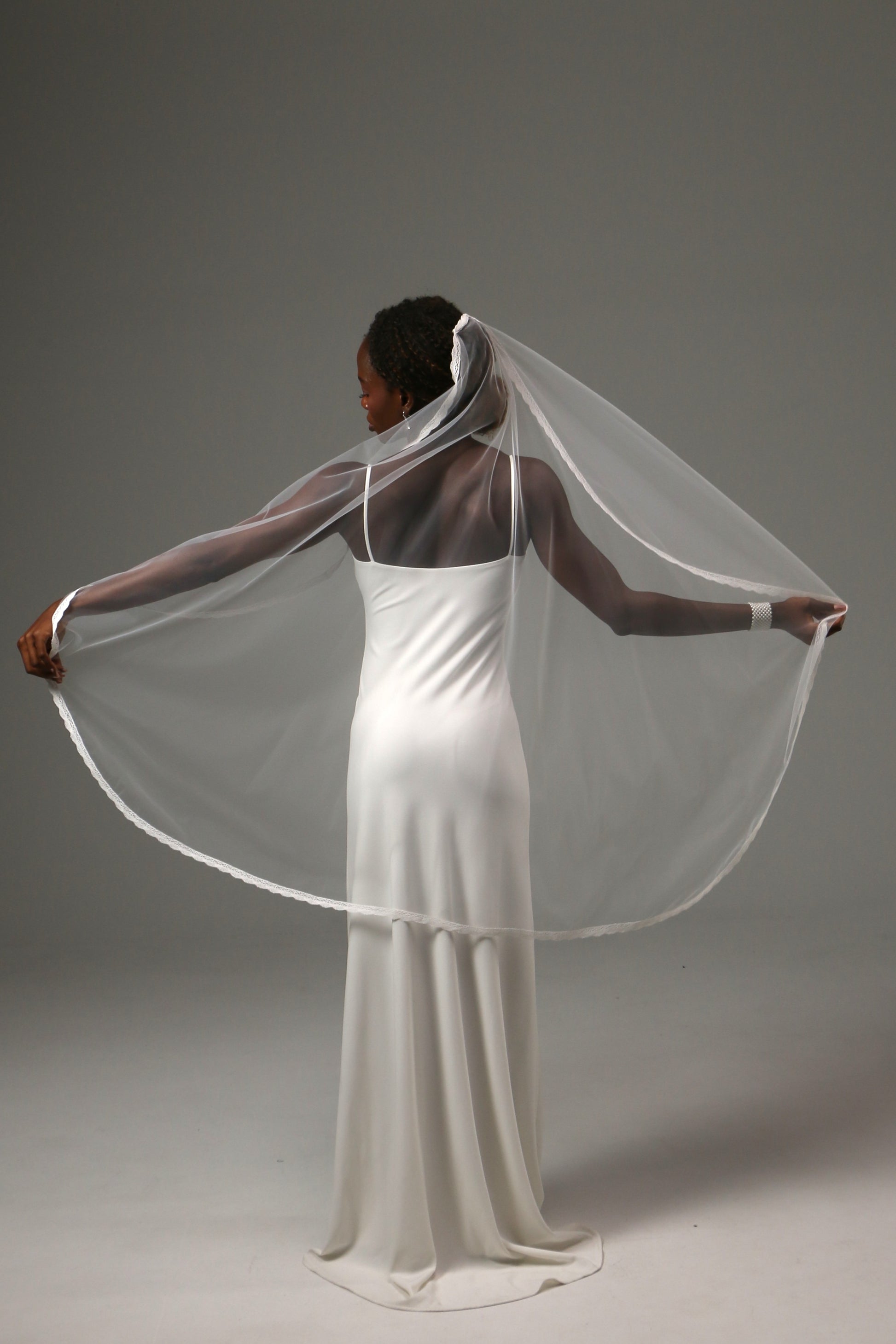 Elegant fingertip veil designed for romantic wedding ceremonies.