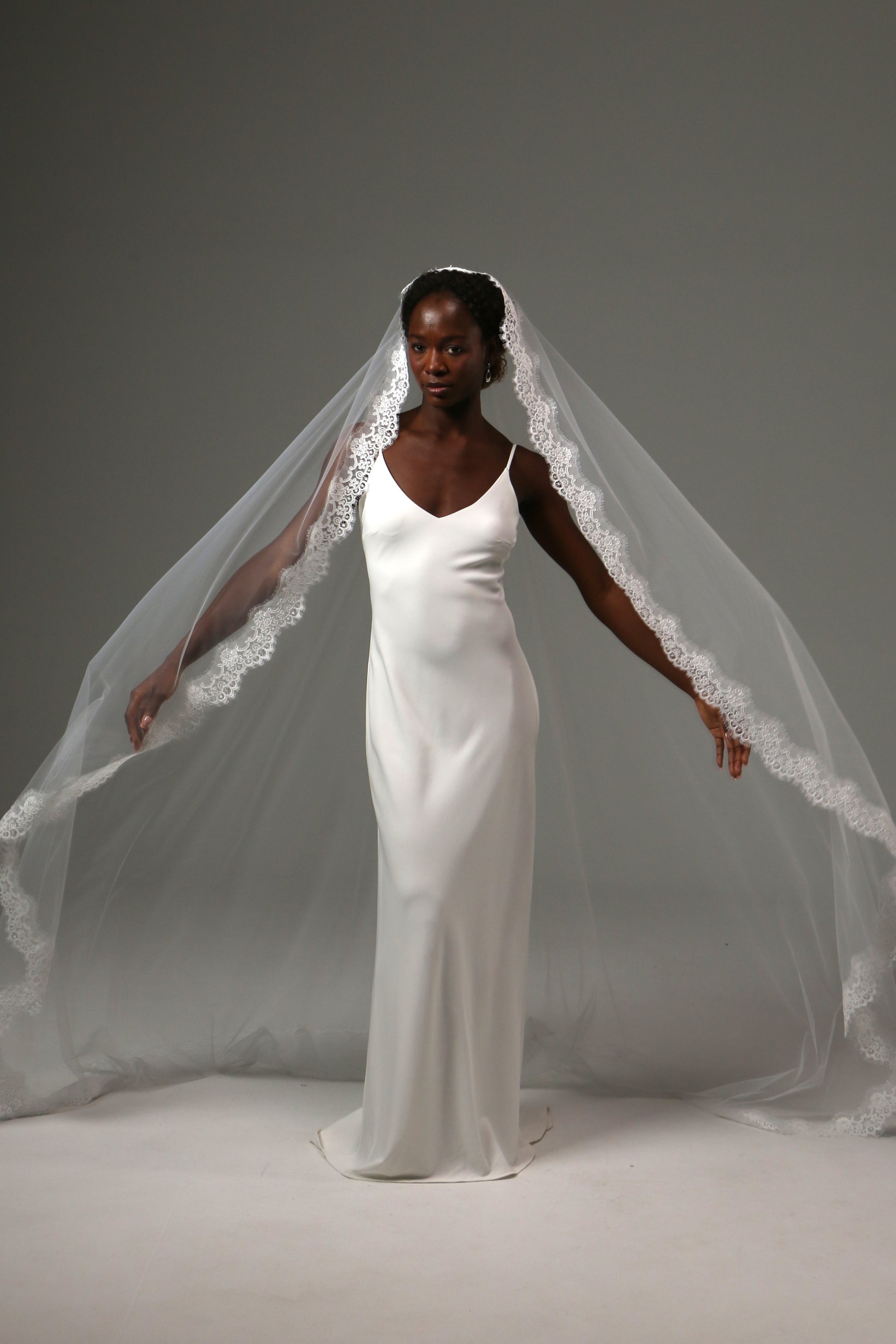 Lightweight lace-edged veil creating a sophisticated bridal look.