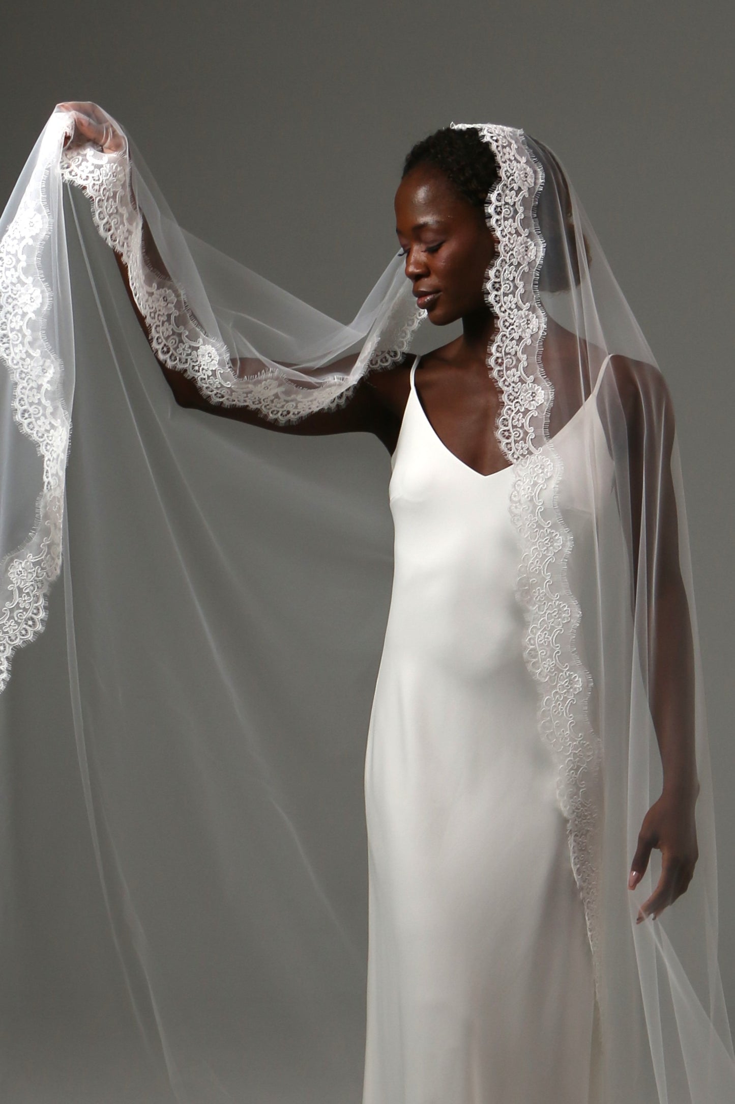 Soft illusion tulle bridal veil with romantic lace border.