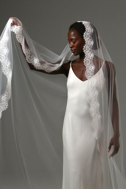 Soft illusion tulle bridal veil with romantic lace border.