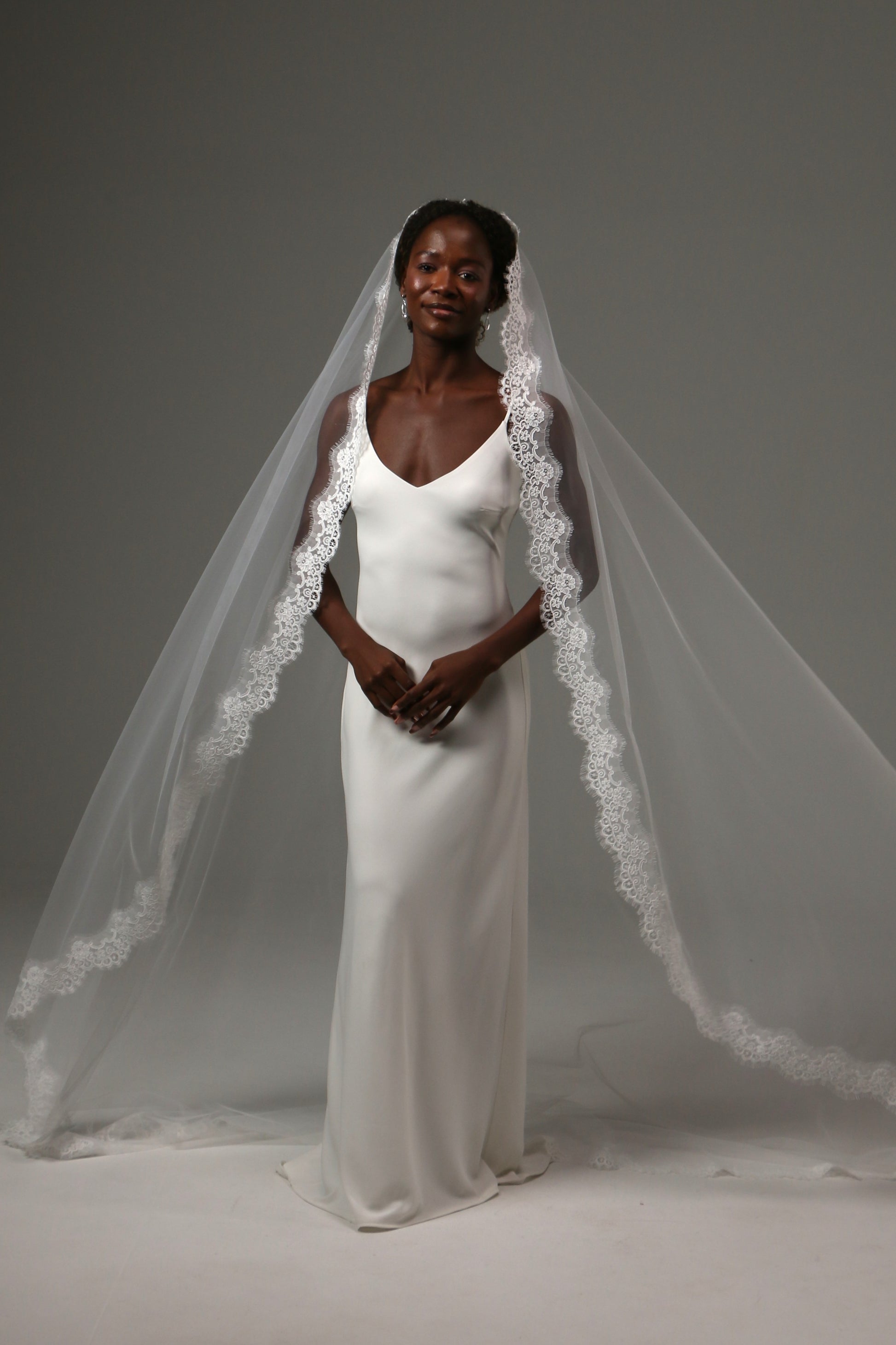 Luxury wedding veil with soft illusion tulle and lace detailing.