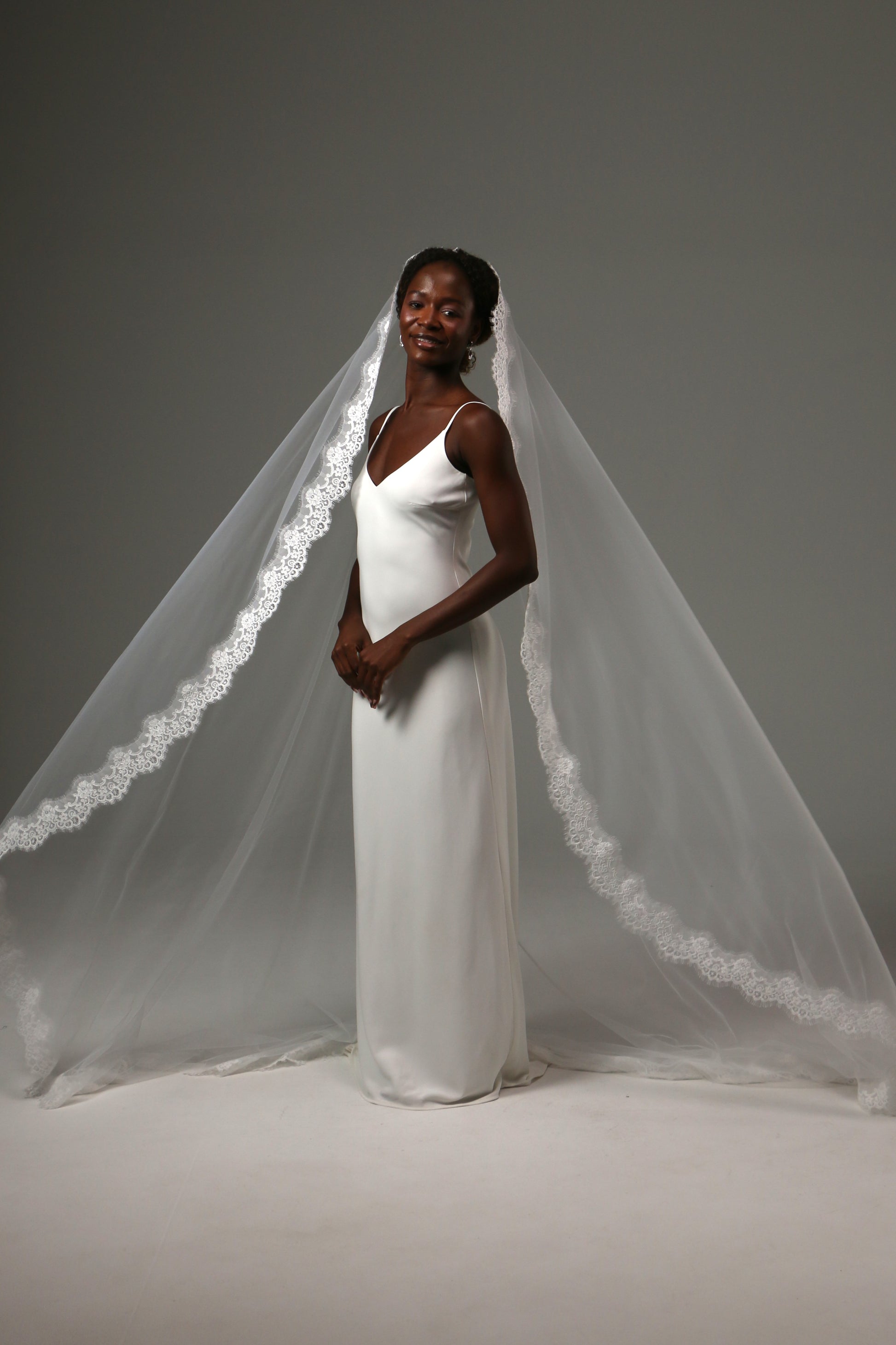 Elegant cathedral wedding veil creating a timeless silhouette.
