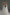 Bride wearing a raw edge wedding veil made of soft tulle in chapel length with a minimalist bridal gown.